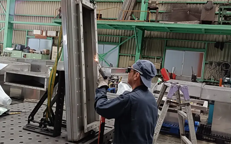 comparison of TIG weld requiring grinding versus clean laser weld on 1mm stainless steel sheet