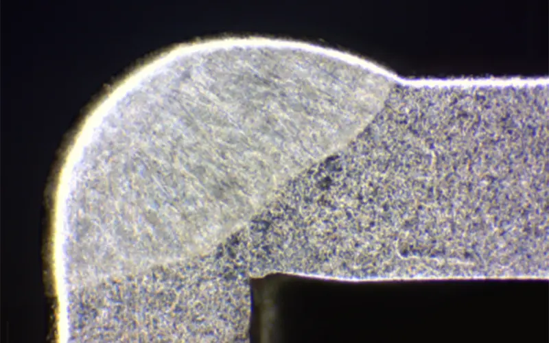 macro-etch cross-section of a laser weld used to verify penetration before buying